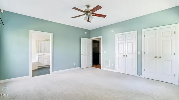 a view of a livingroom with a chandelier fan