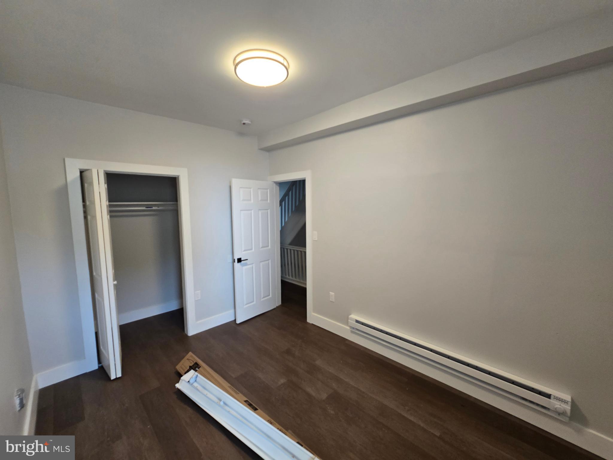1321 West Wingohocking Street, Unit 2 Philadelphia, PA 19140 - Photo 19 of 26 an empty room with wooden floor and closet