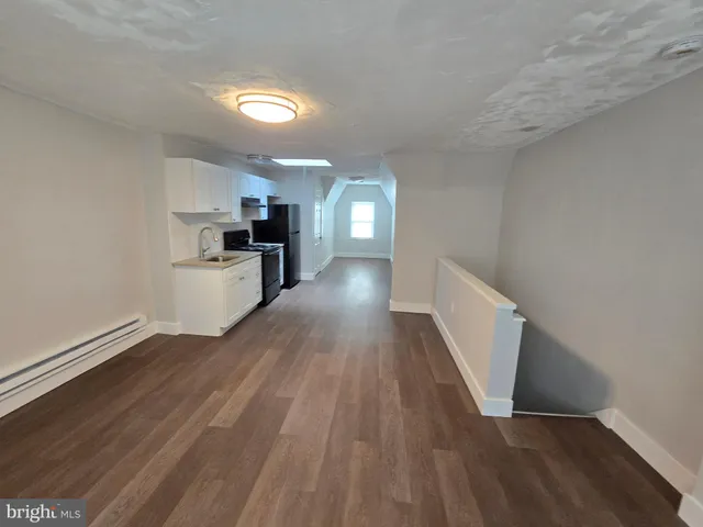 a view of a kitchen and a sink