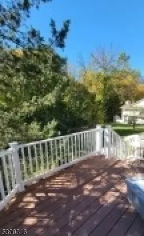 a view of a wooden deck with sunset view