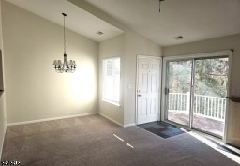 64 Encampment Drive Bedminster, NJ 07921 - Photo 2 of 17 a view of a room with wooden floor and windows