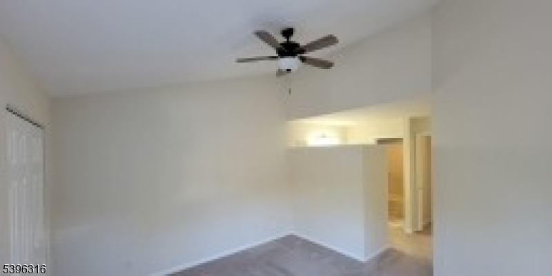 64 Encampment Drive Bedminster, NJ 07921 - Photo 9 of 17 a view of a hallway with a ceiling fan