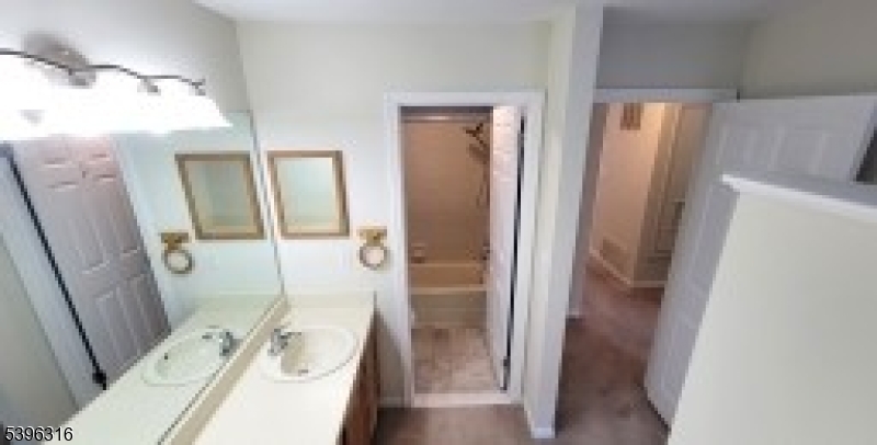 64 Encampment Drive Bedminster, NJ 07921 - Photo 10 of 17 a bathroom with a tub sink and mirror