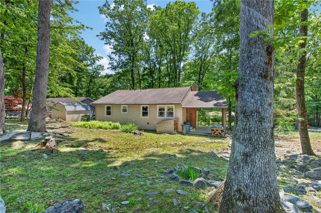 18 White Oak Road Nesquehoning, PA 18240 - Photo 38 of 52 A tranquil woodland setting surrounds this charming residence, offering serene privacy and natural beauty.
