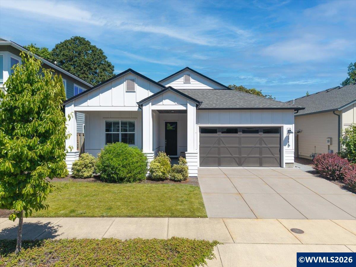 1115 Southwest Sylvia Street Corvallis, OR 97333 - Photo 21 of 22 a front view of a house with a yard and garage
