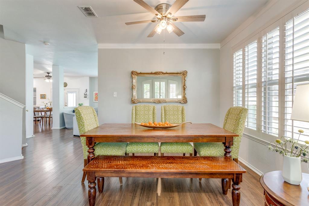 4816 Sleepy Ridge Circle Fort Worth, TX 76133 - Photo 7 of 36 Dining area featuring ceiling fan, wood finished floors, and crown molding