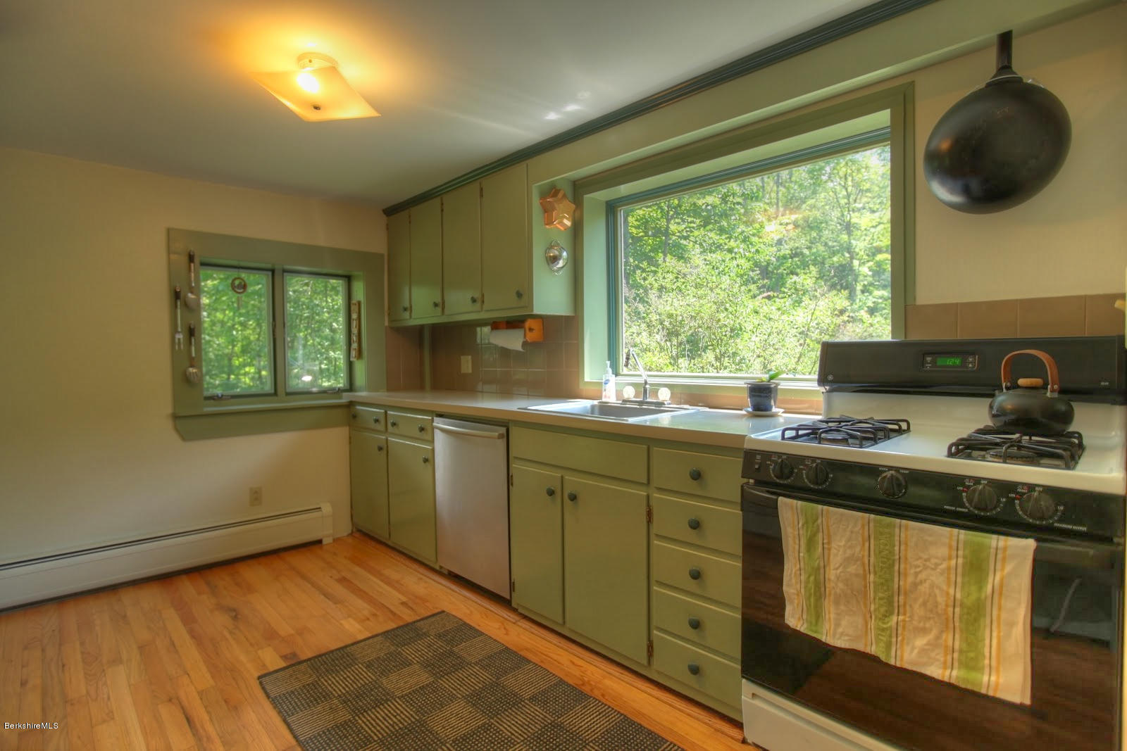 285 North Beech Plain Road Sandisfield, MA 01255 - Photo 22 of 40 a kitchen with a stove a sink and a window