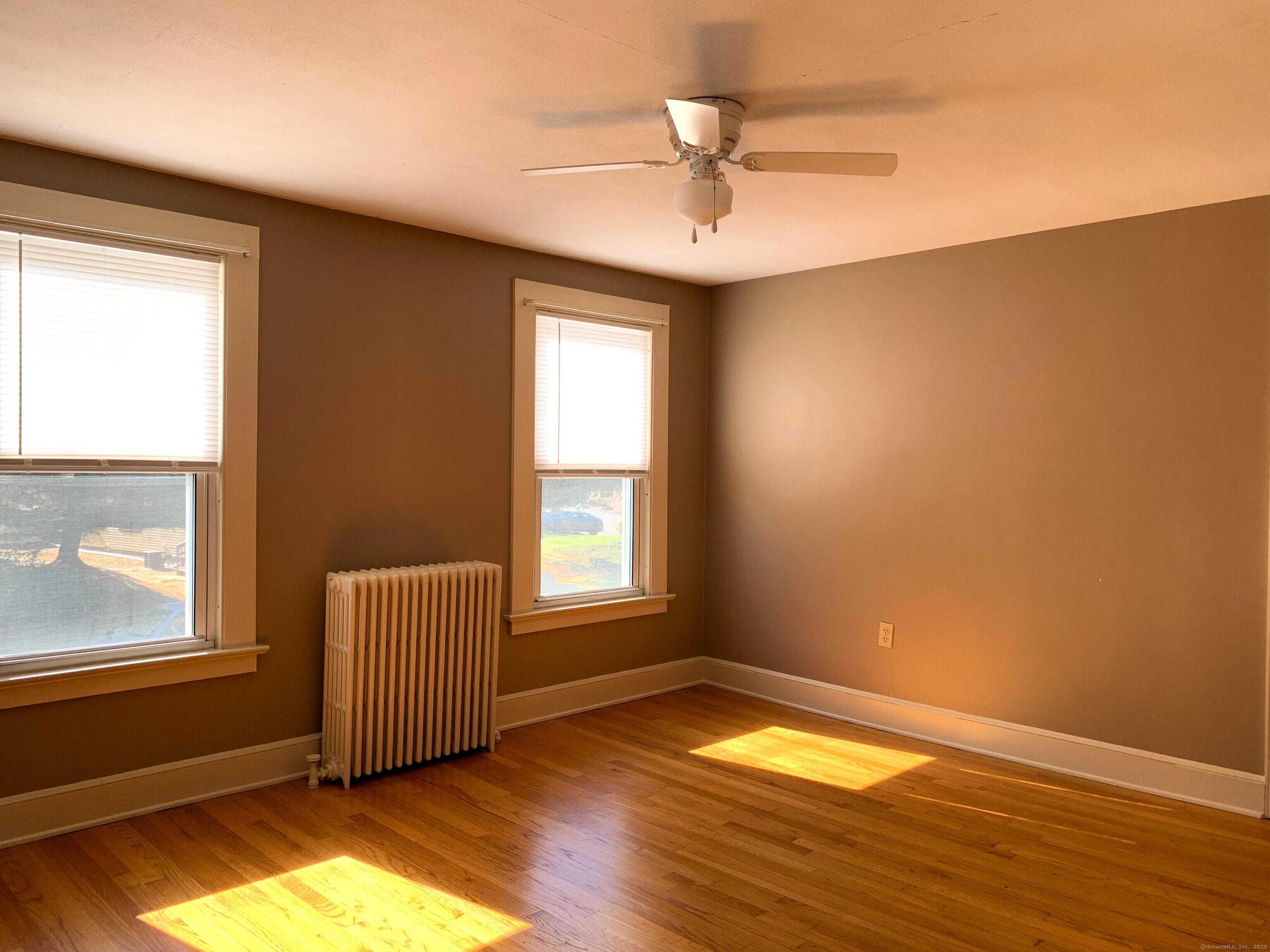 96 Main Street, Unit 2 Branford, CT 06405 - Photo 5 of 10 a view of empty room with wooden floor and fan