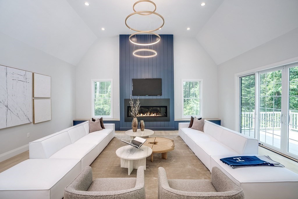 68 Clarke Circle Needham, MA 02492 - Photo 16 of 40 a living room with furniture fireplace and flat screen tv