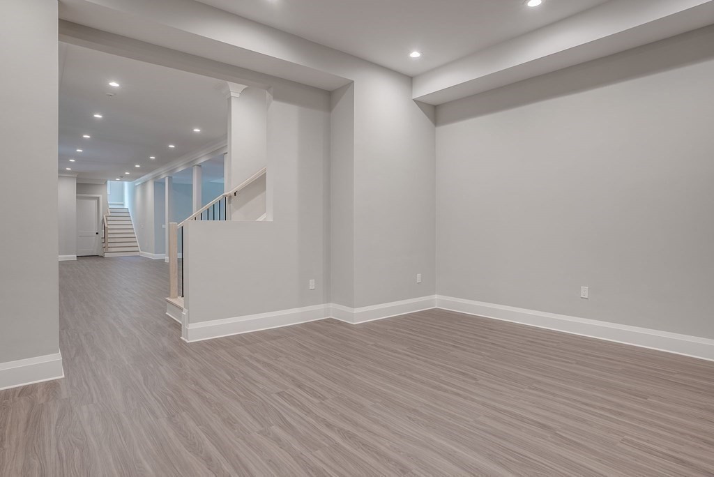 68 Clarke Circle Needham, MA 02492 - Photo 33 of 40 a view of a hallway with wooden floor
