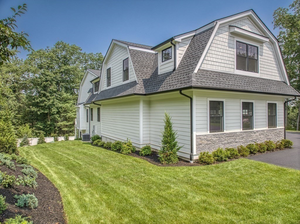 68 Clarke Circle Needham, MA 02492 - Photo 34 of 40 a front view of a house with a yard