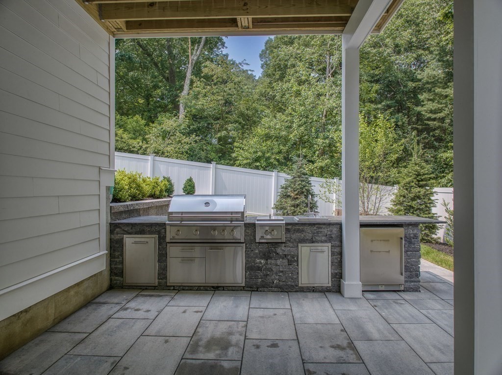 68 Clarke Circle Needham, MA 02492 - Photo 39 of 40 a view of a kitchen with a sink and dishwasher stove