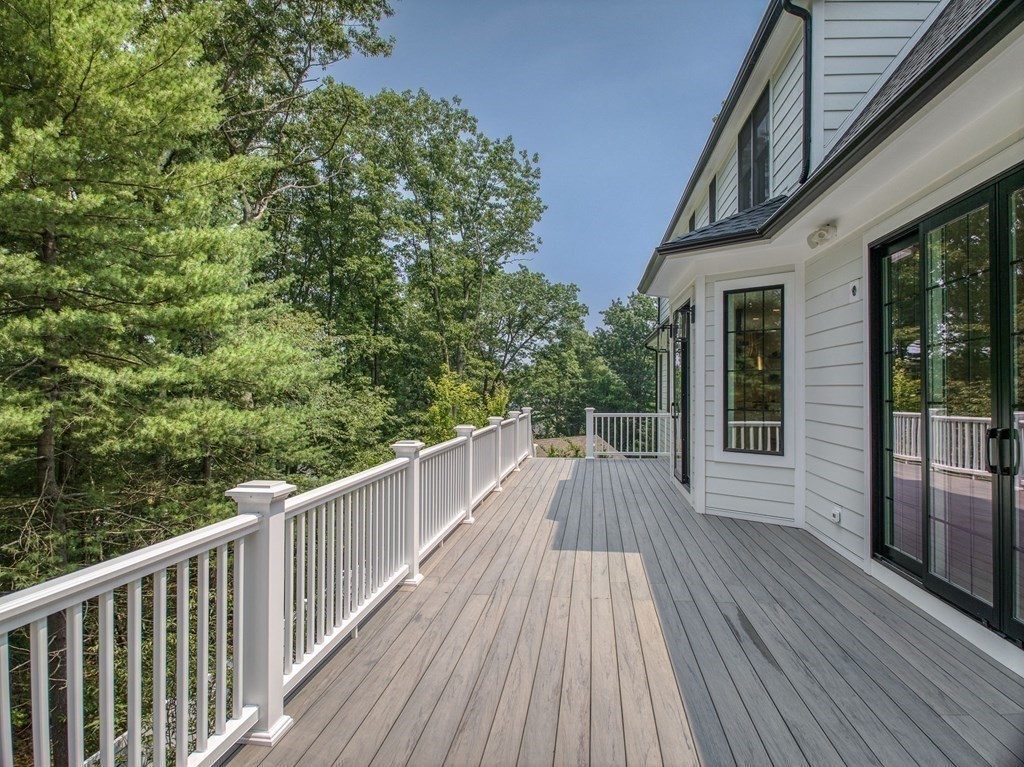 68 Clarke Circle Needham, MA 02492 - Photo 40 of 40 a view of balcony with wooden floor and fence