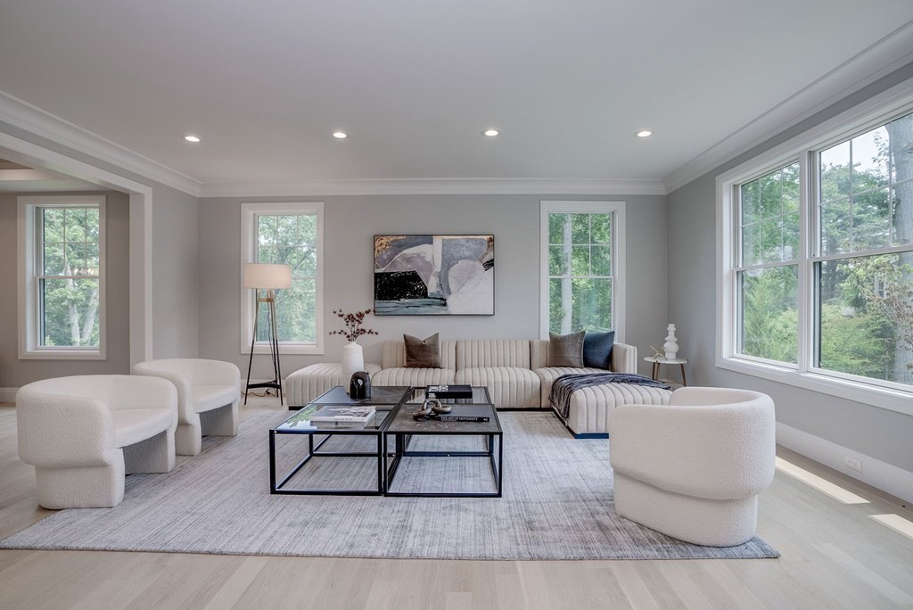 68 Clarke Circle Needham, MA 02492 - Photo 7 of 40 a living room with furniture and a flat screen tv