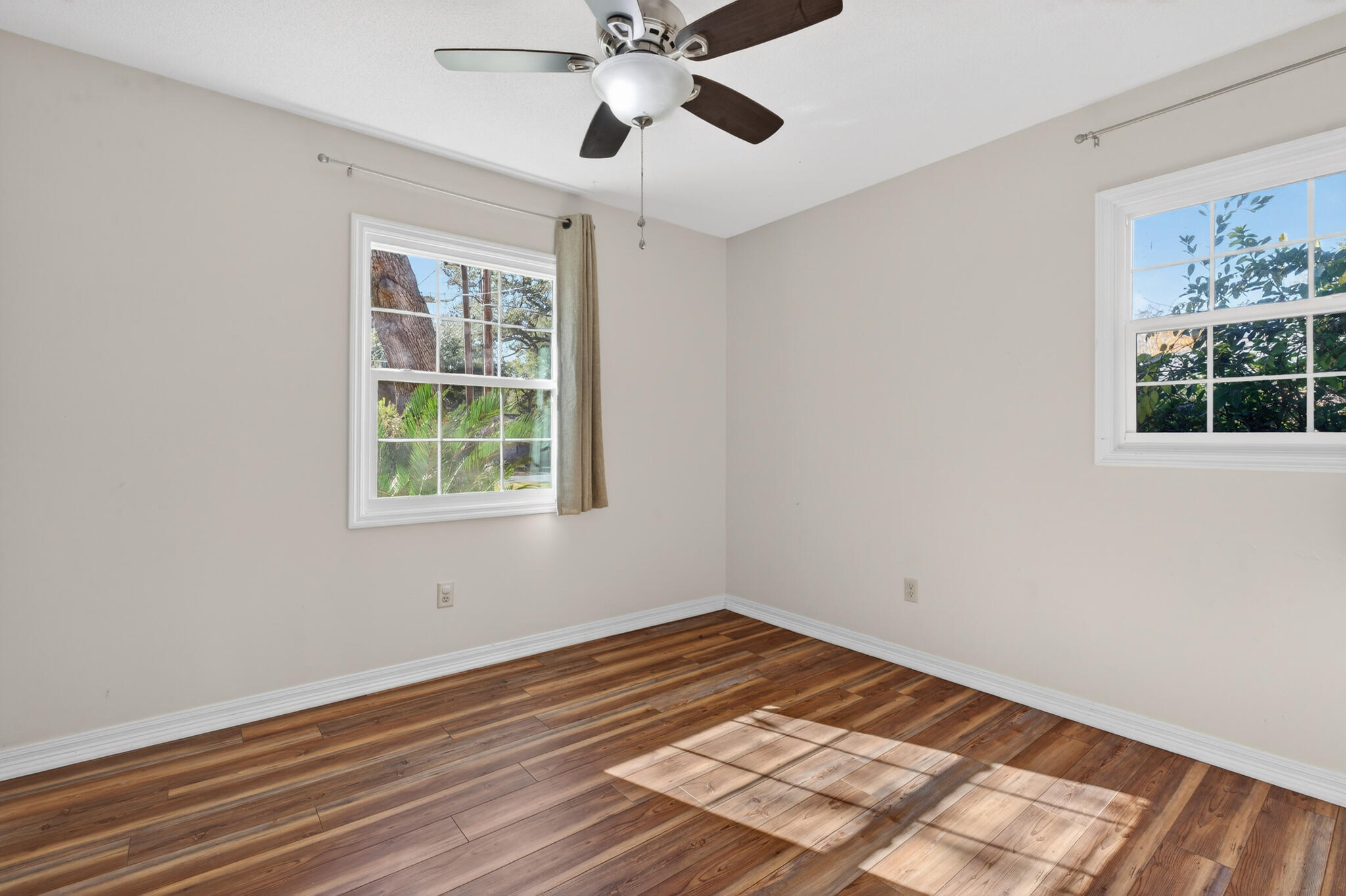 9 Walnut Avenue Shalimar, FL 32579 - Photo 16 of 61 a view of empty room with window and wooden floor
