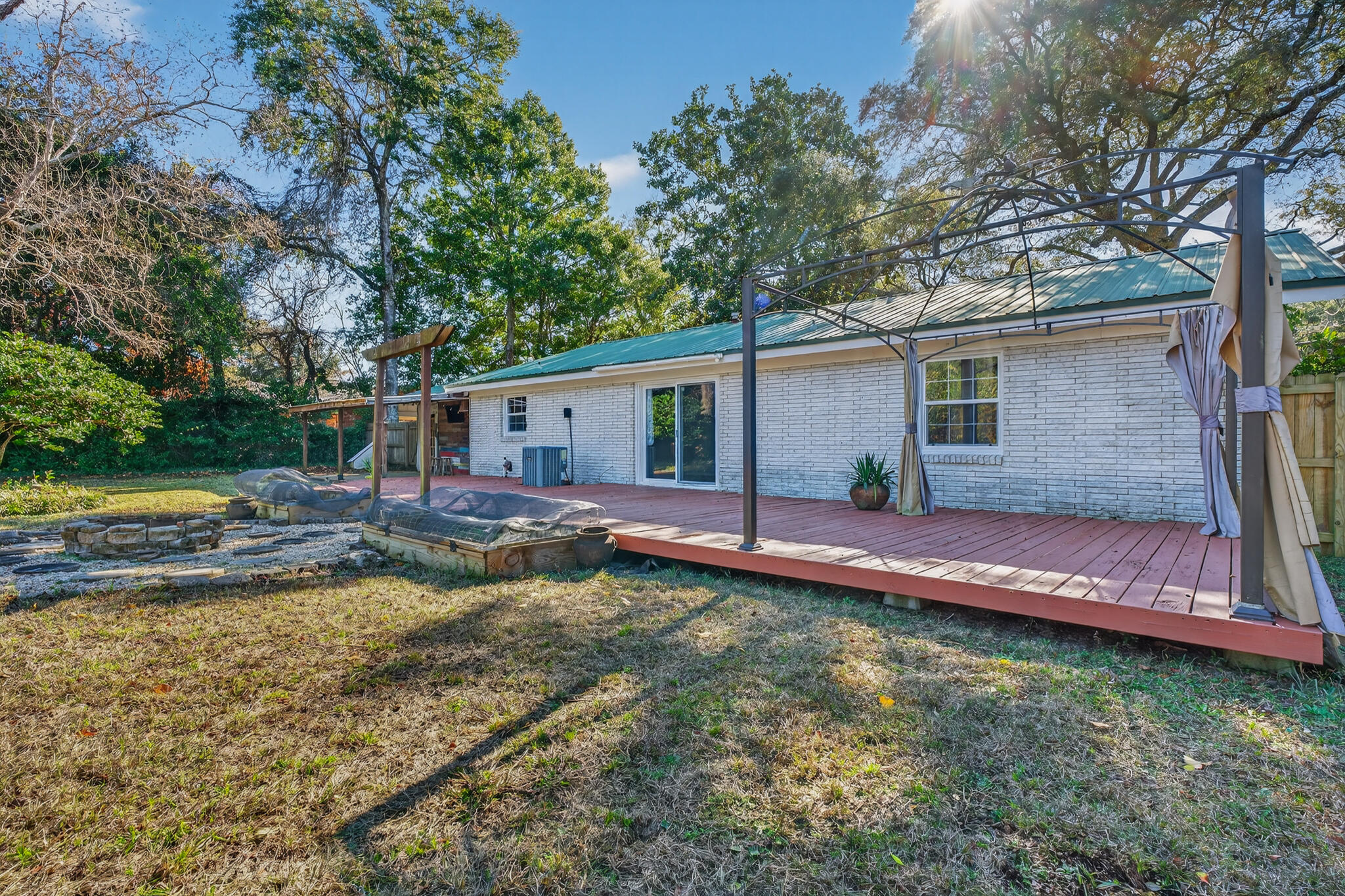 9 Walnut Avenue Shalimar, FL 32579 - Photo 35 of 61 a view of a house with backyard and swimming pool