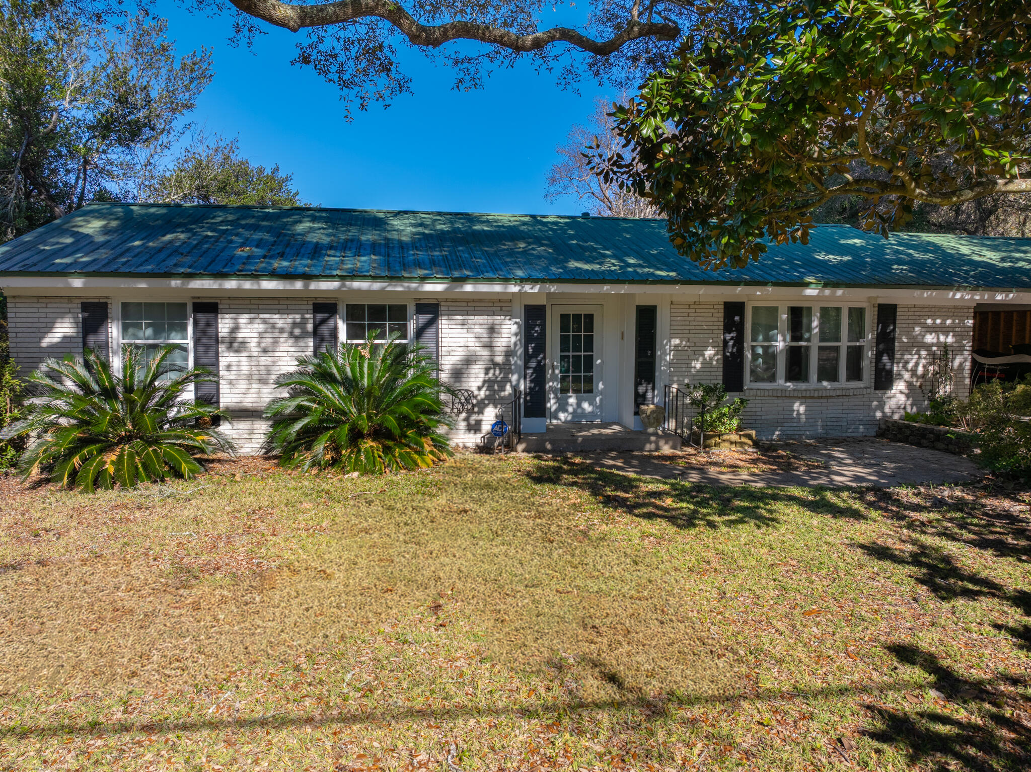 9 Walnut Avenue Shalimar, FL 32579 - Photo 42 of 61 a view of a house with backyard porch and sitting area