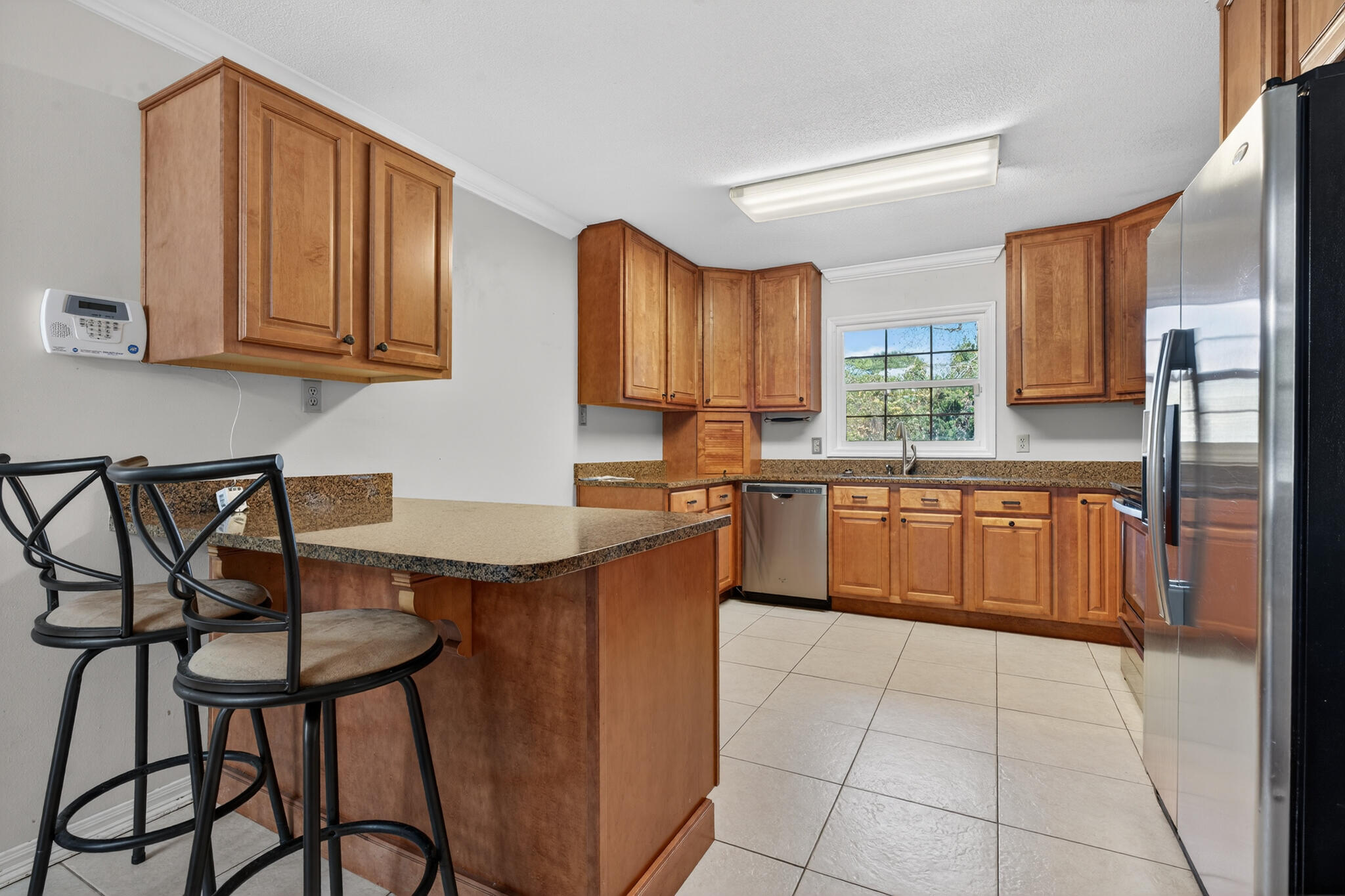 9 Walnut Avenue Shalimar, FL 32579 - Photo 6 of 61 a kitchen with stainless steel appliances granite countertop a table chairs sink and cabinets