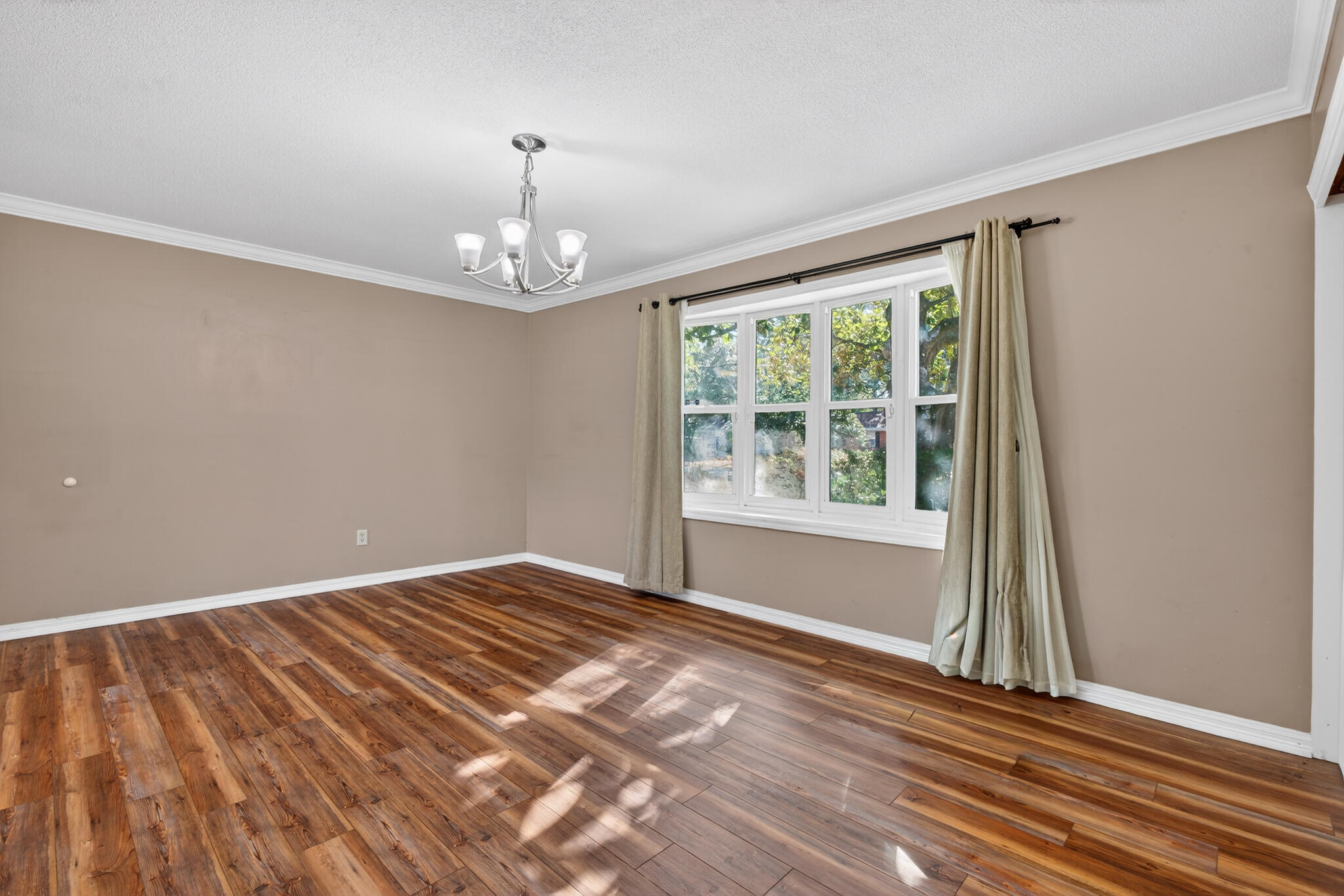9 Walnut Avenue Shalimar, FL 32579 - Photo 10 of 61 wooden floor in an empty room with a window
