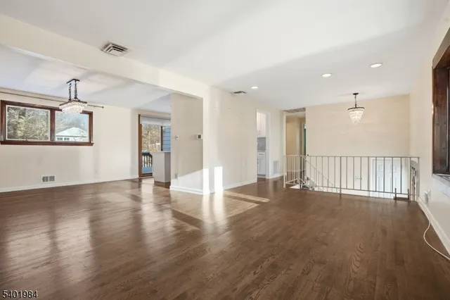 a view of a livingroom with wooden floor