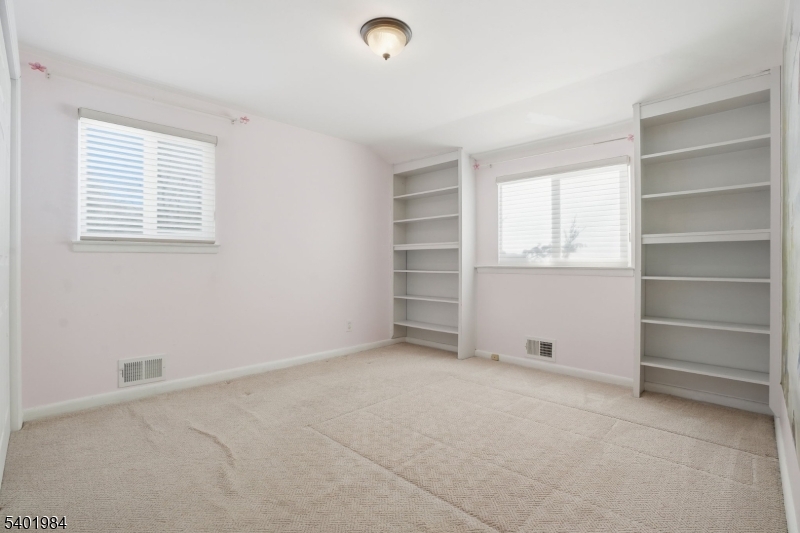 95 Martin Road Livingston, NJ 07039 - Photo 21 of 26 a view of an empty room with a window