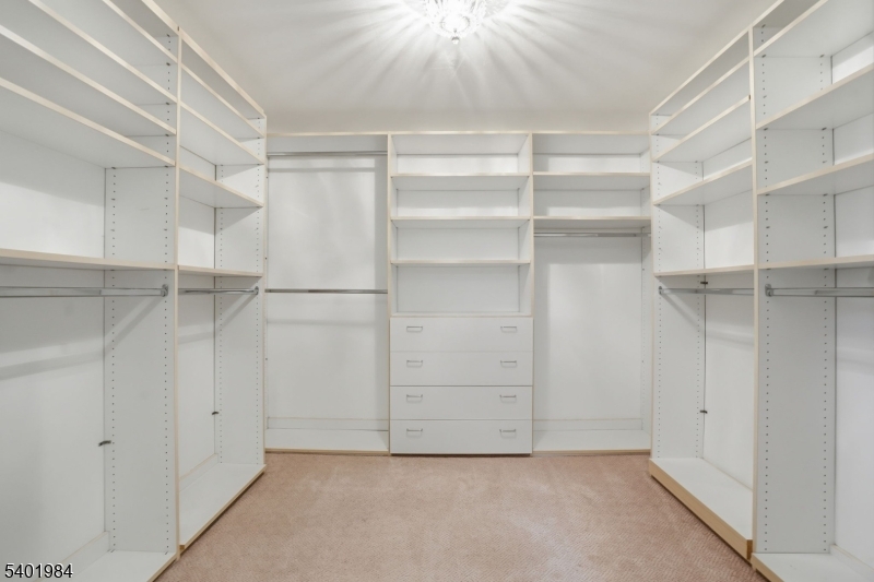 95 Martin Road Livingston, NJ 07039 - Photo 24 of 26 a view of walk in closet with empty racks