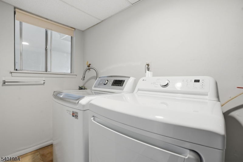 95 Martin Road Livingston, NJ 07039 - Photo 10 of 26 a utility room with dryer and washer
