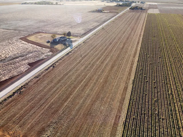 a view of a balcony with wooden floor