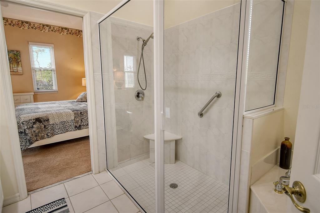 6504 Copper Ridge Trail Bradenton, FL 34201 - Photo 25 of 55 Shower in primary bath with handicap rail and shower seat
