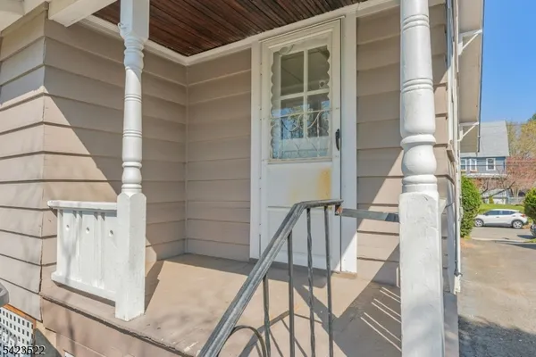 a front view of a house with a garden and yard