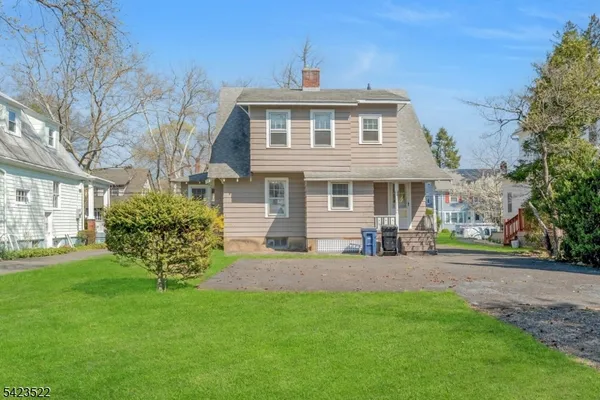 a view of a house with a big yard