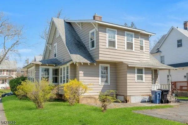 a view of a park with large trees