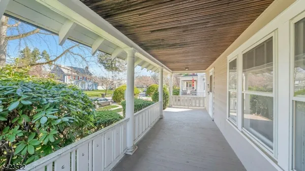 a view of a livingroom with an empty space and wooden floor