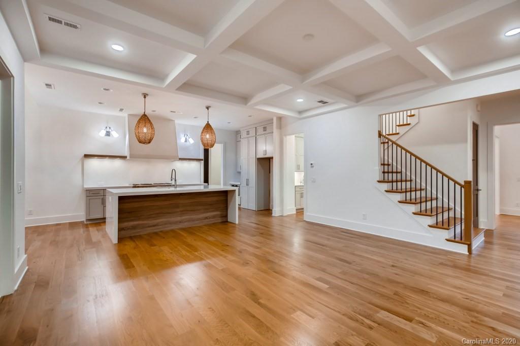 1104 Vision Path Concord, NC 28027 - Photo 11 of 28 a room with wooden floors and staircase