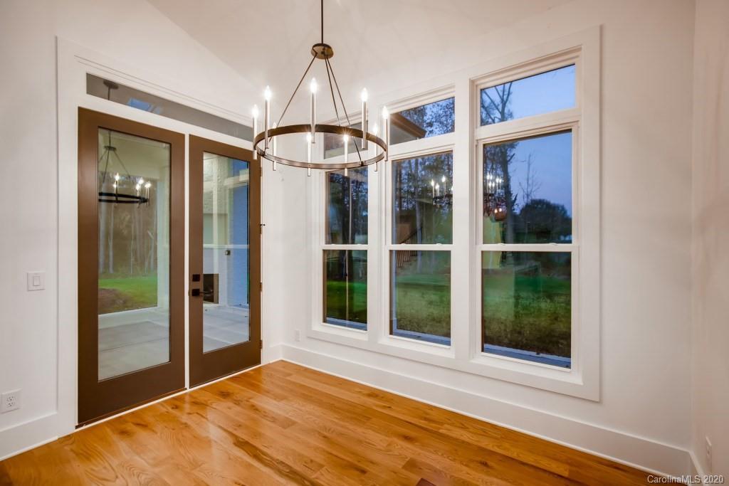 1104 Vision Path Concord, NC 28027 - Photo 13 of 28 a view of a bedroom with a large window and wooden floor
