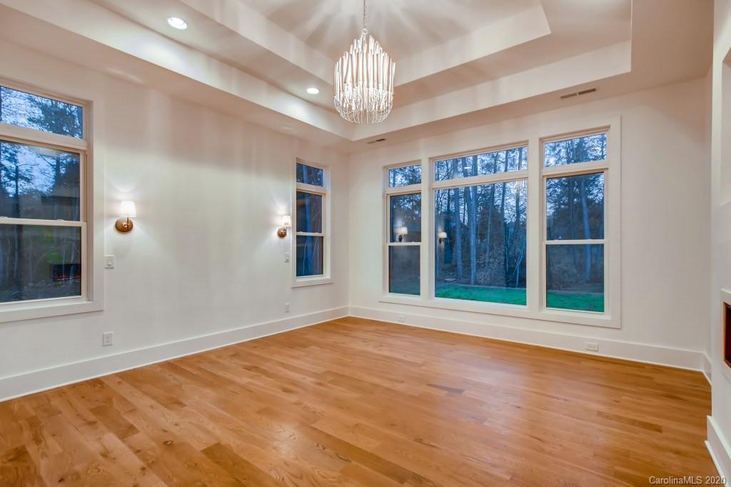 1104 Vision Path Concord, NC 28027 - Photo 14 of 28 a view of an empty room with wooden floor and a window