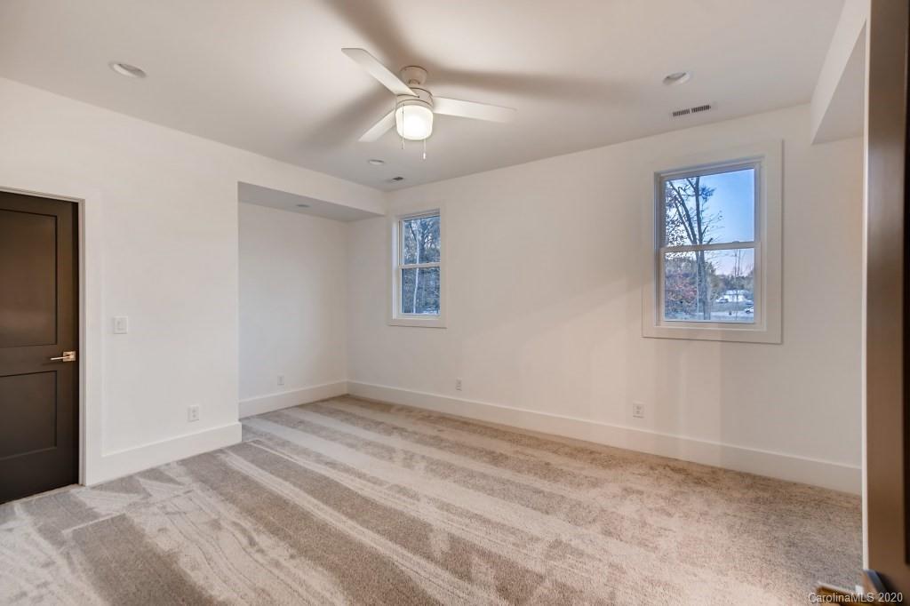 1104 Vision Path Concord, NC 28027 - Photo 20 of 28 a view of room with window and ceiling fan