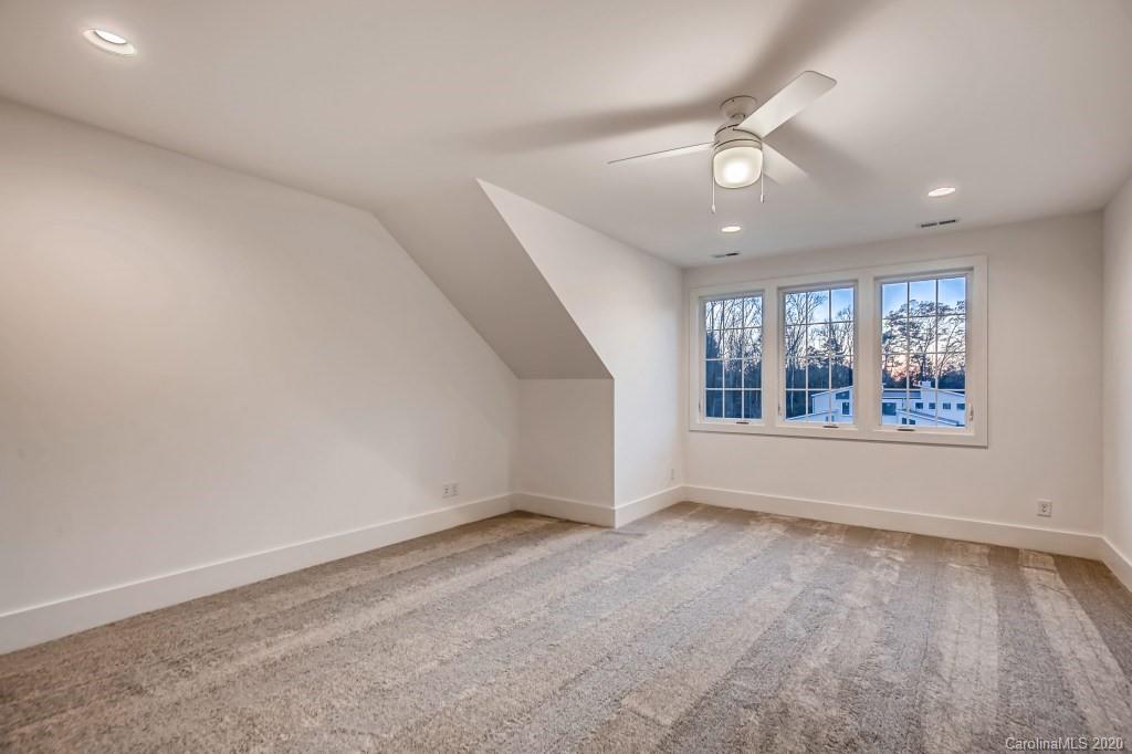 1104 Vision Path Concord, NC 28027 - Photo 22 of 28 an empty room with wooden floor and windows