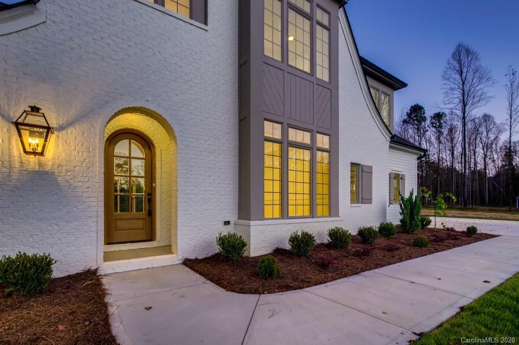 1104 Vision Path Concord, NC 28027 - Photo 4 of 28 a view of a house with brick walls and potted plants