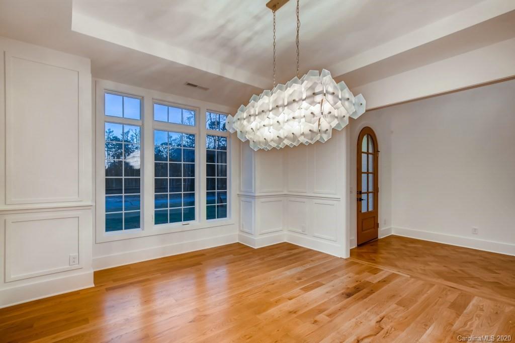 1104 Vision Path Concord, NC 28027 - Photo 7 of 28 a view of an empty room with wooden floor and a window