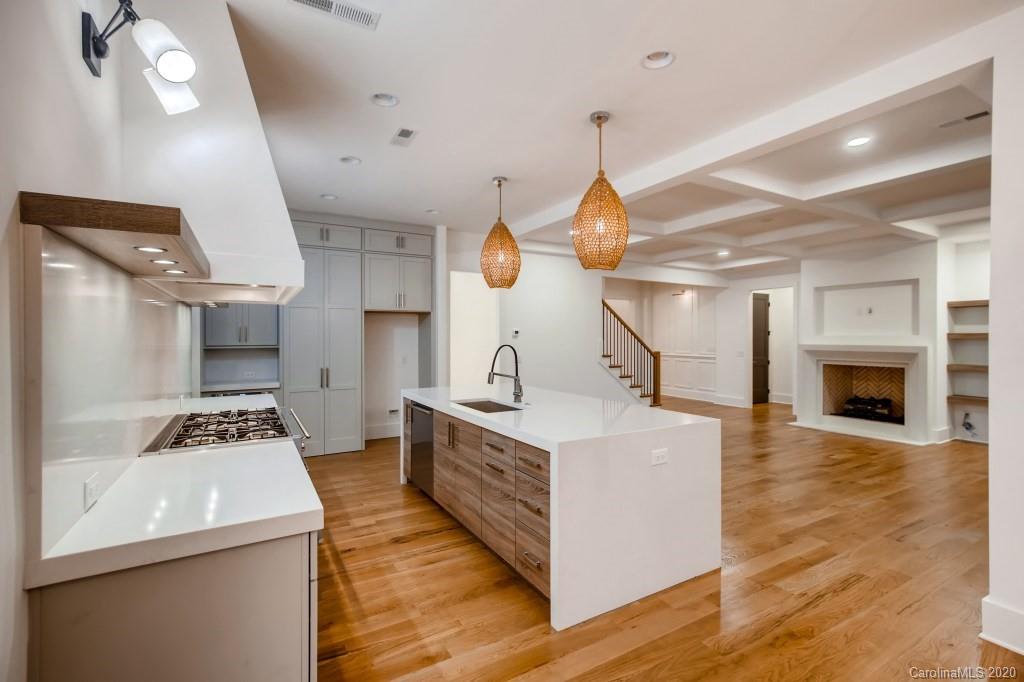1104 Vision Path Concord, NC 28027 - Photo 9 of 28 a kitchen with a stove and a wooden floor