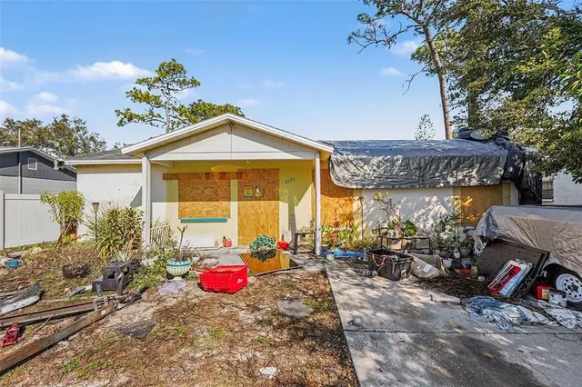 a front view of a house with outdoor seating