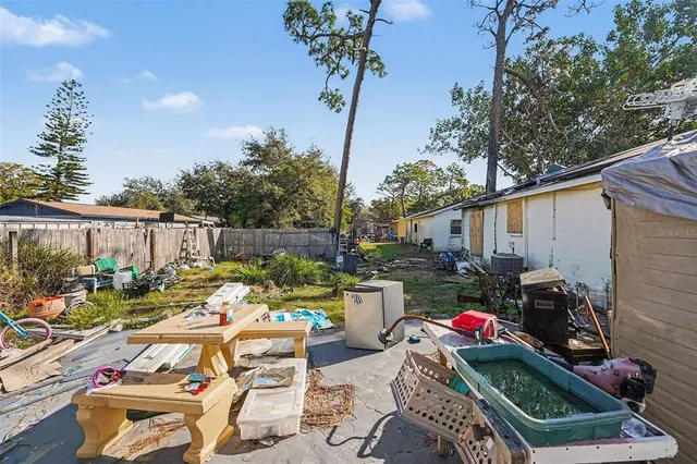 a view of a backyard with sitting area and furniture