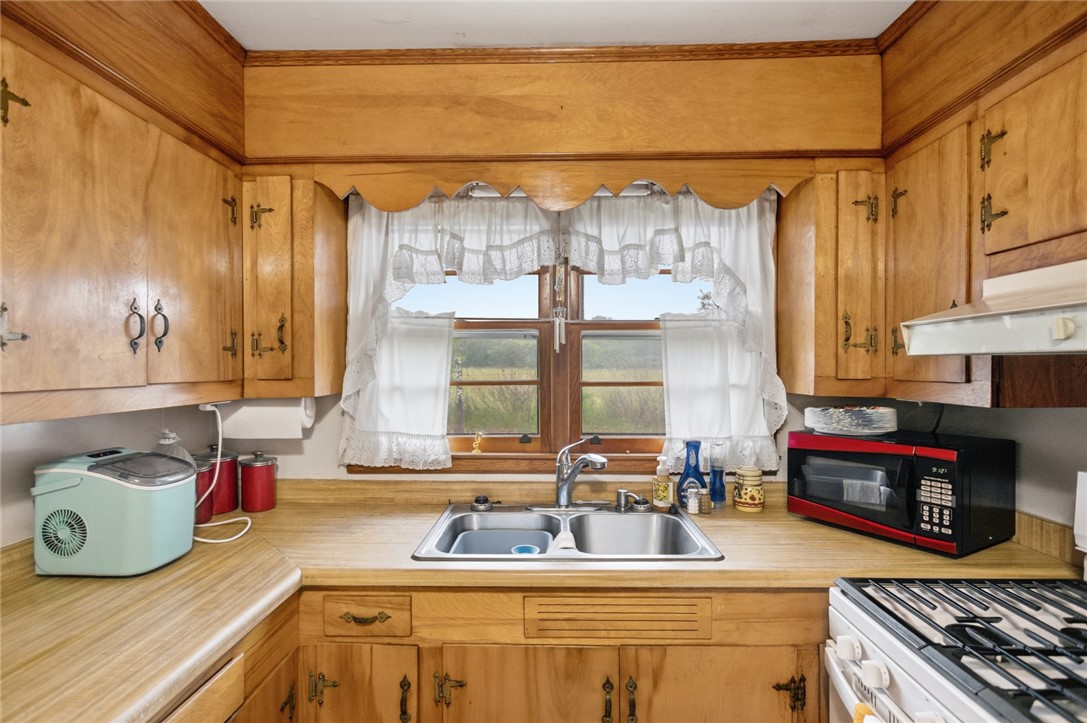 282 West Bennett Road Westminster, SC 29693 - Photo 9 of 42 This cozy kitchen features abundant wood cabinetry and a functional layout, ideal for everyday living.