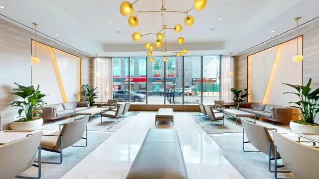 a living room with patio furniture and a large window