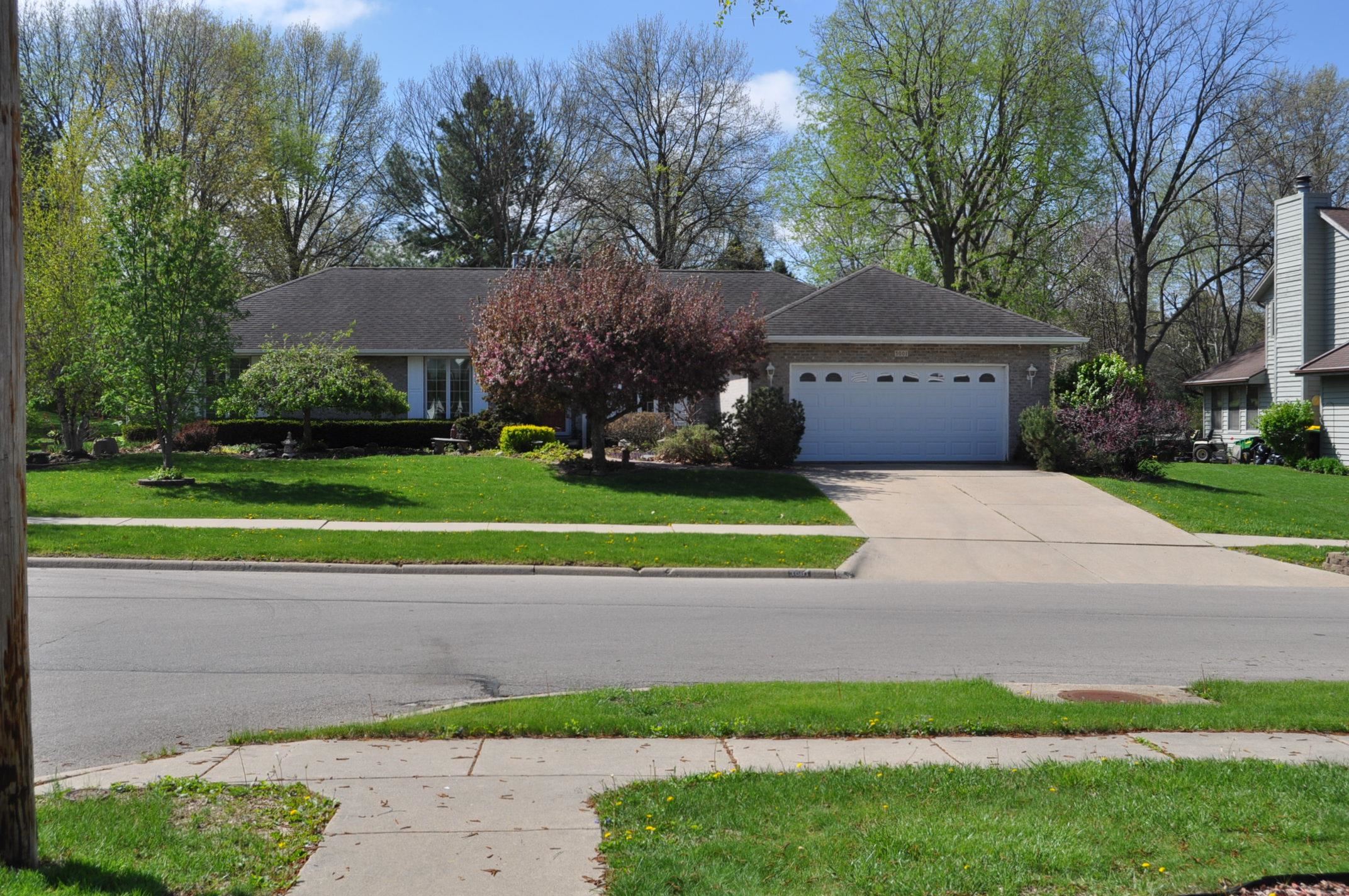 3001 Countryside Lane Freeport, IL 61032 - Photo 1 of 47 a view of a house with a small yard and large trees