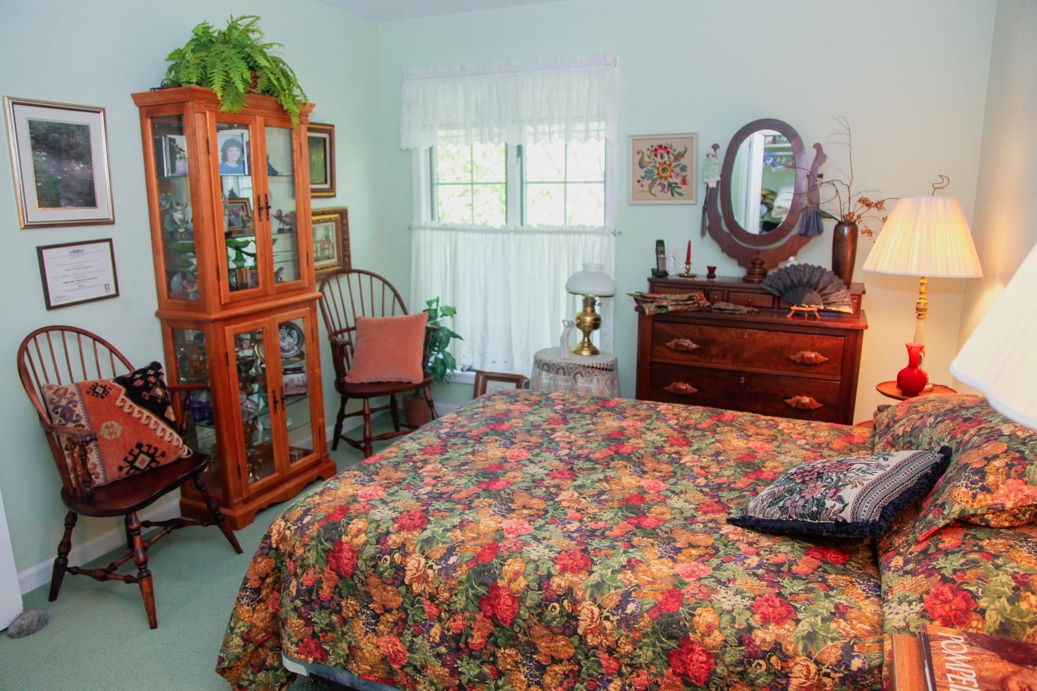 3001 Countryside Lane Freeport, IL 61032 - Photo 14 of 47 a bed room with a bed mirror and furniture