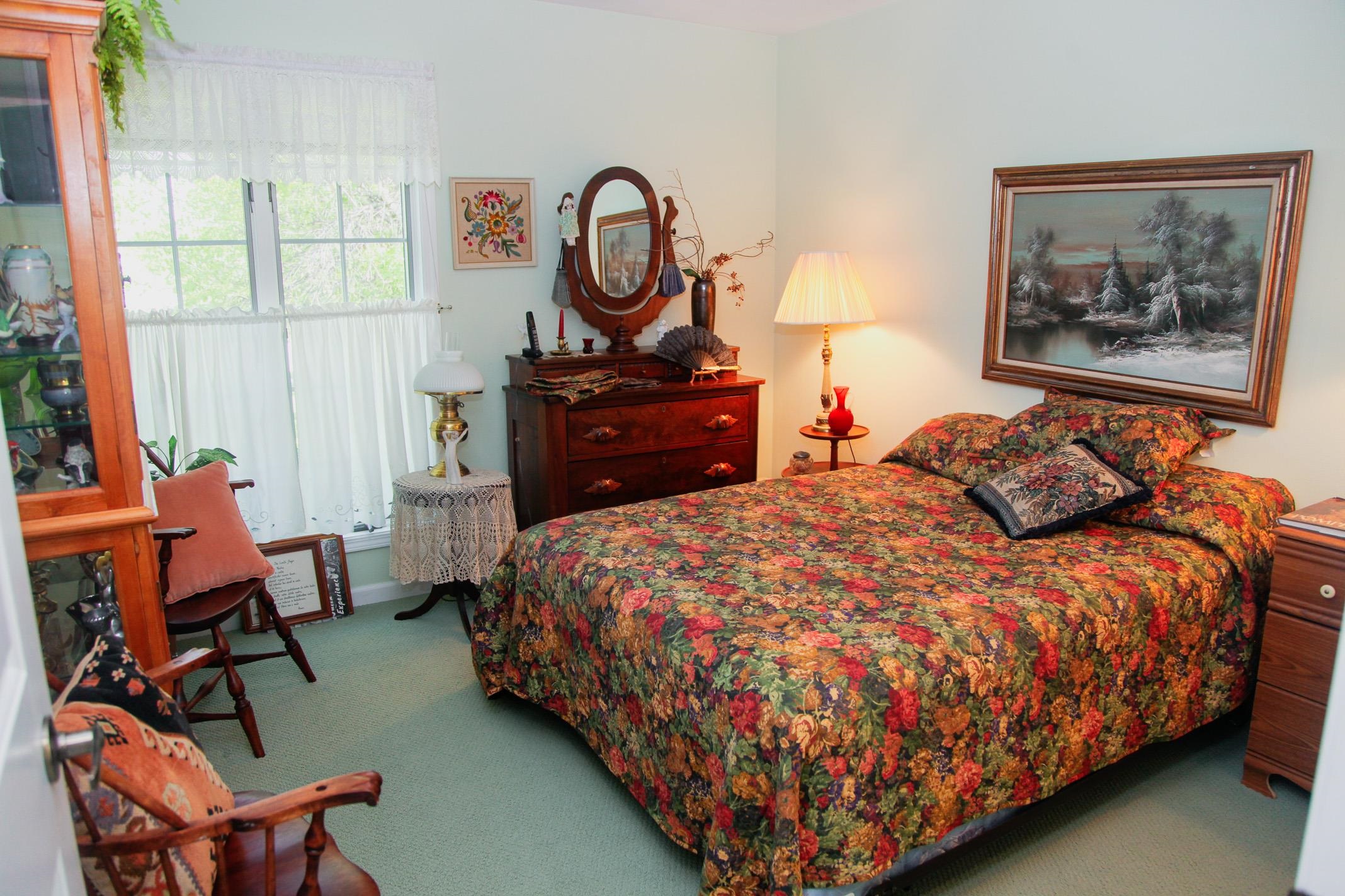 3001 Countryside Lane Freeport, IL 61032 - Photo 15 of 47 a bed sitting in a bedroom next to a window