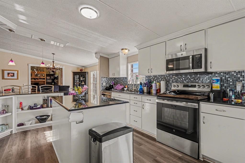 21664 Highway 34 Terrell, TX 75161 - Photo 13 of 34 a kitchen with cabinets a sink and appliances