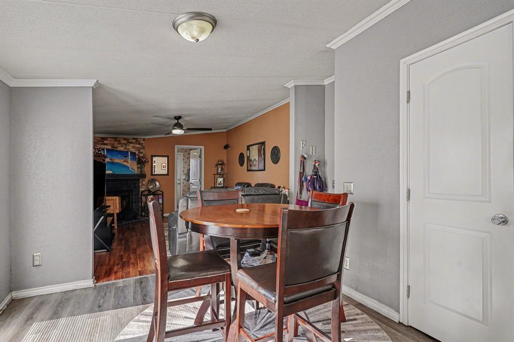 21664 Highway 34 Terrell, TX 75161 - Photo 15 of 34 a view of a dining room with furniture and wooden floor